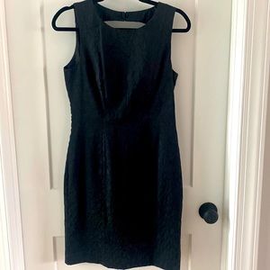 Fitted black pencil dress with keyhole back. Satin with animal pattern sz 8